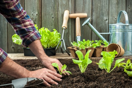 Landscaper using PPE while preparing a garden project